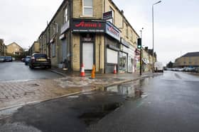Water leak causing icy pavement at whitehall Street / Leeds Road, Hipperholme