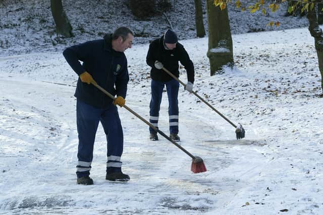 Robert Butler (left) and Andrew Sutcliffe clear the drive at Shibden Park