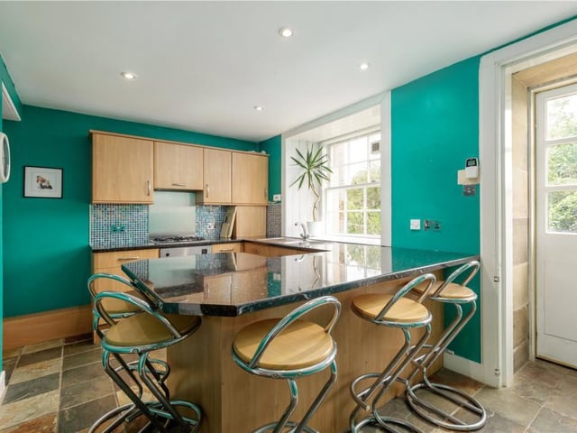 Garden level kitchen with door to rear garden.