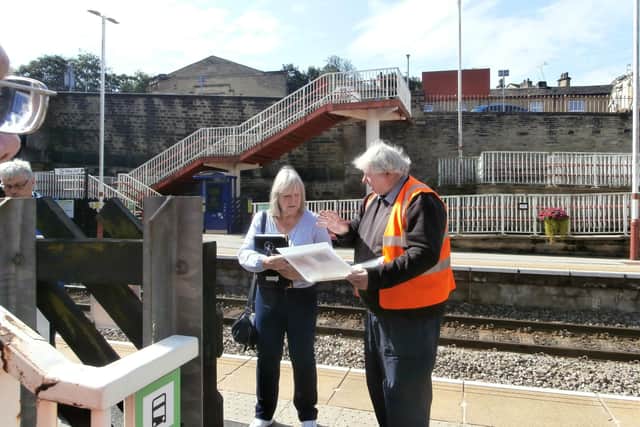 Brighouse Railway Station showing round an In Bloom judge earlier this year.