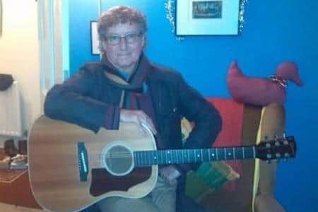 John Armstrong, a school friend of Trevor Beales, with his old guitar.