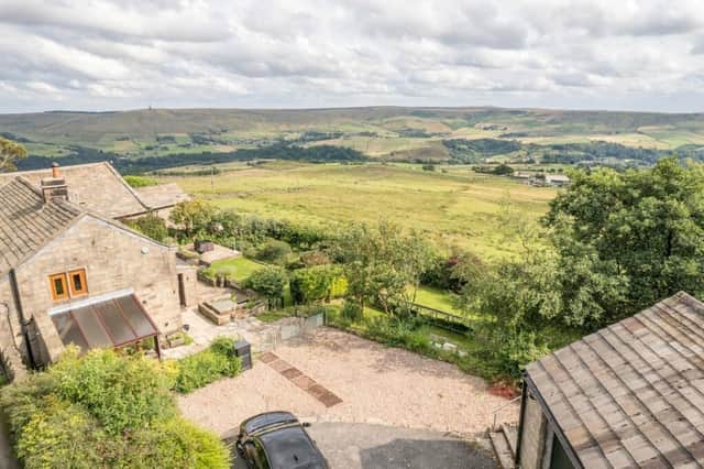 Looking over the farmhouse and the stunning views it enjoys from both inside and out.