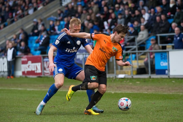 Jordan Burrow tries to win the ball back for Town