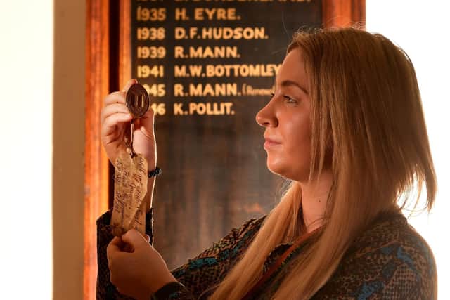 Anya Friis the Development and Relationship Leader pictured with the Brass Matrix from the collection. Picture taken by Yorkshire Post Photographer Simon Hulme 28th March 2023