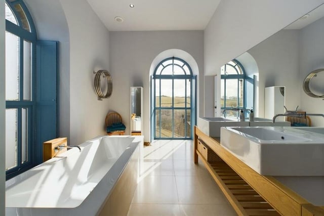 A contemporary bathroom, with lovely views.