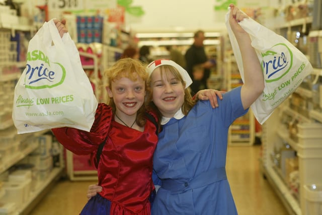 Katie Allcott, 13 ,and Abigail Margetts, 11 - members of the Calderdale Theatre School bag packing at Asda, Halifax