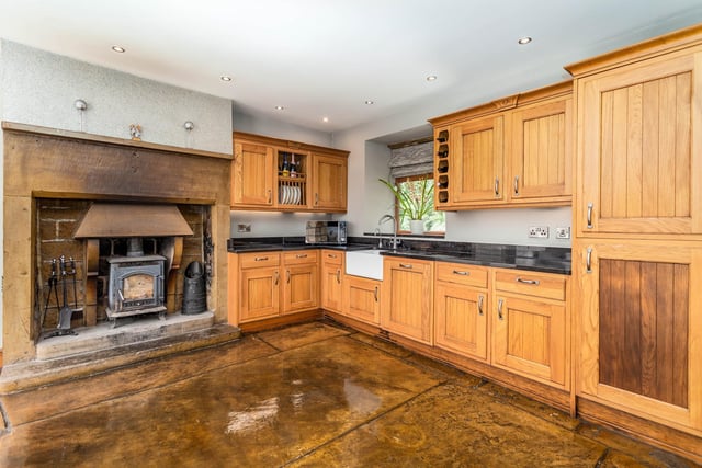 The kitchen and breakfast room has a Yorkshire stone flagged floor, and bespoke solid oak units with granite worktops.