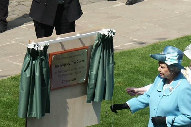 The Queen unveils a plaque at the Piece Hall, Halifax, on her visit in 2004. Picture: Calderdale Council