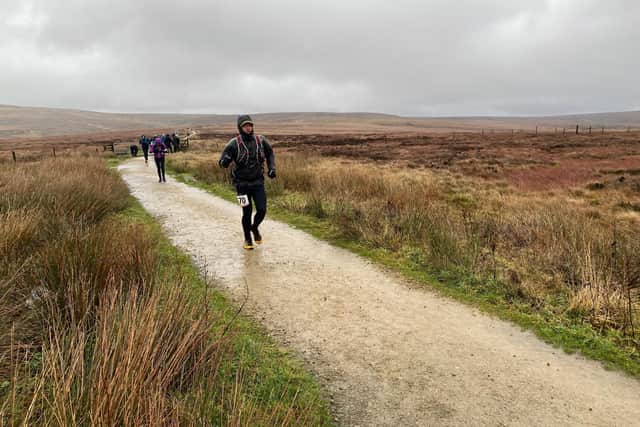 Calder Valley Fell Runners' Oliver Beaumont braves the elements in the 21-mile Trigger Fell Race. Picture: Brian Barnes.