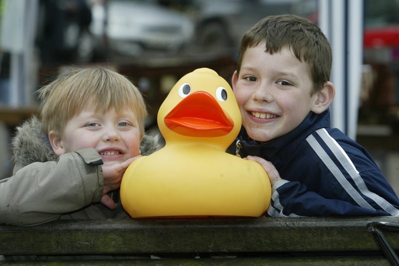 Brothers Harry and Daniel White, aged three and nine in 2005, prepare for the Hebden Bridge Duck race on Monday afternoon.