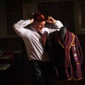 Artifacts and exhibits on show at The Crossley Heath School, Savile Park, Halifax. Former Head Boy Jon Hamer pictured with his original prefects 6th Form Blazer from 1982.  Picture taken by Yorkshire Post Photographer Simon Hulme 28th March 2023