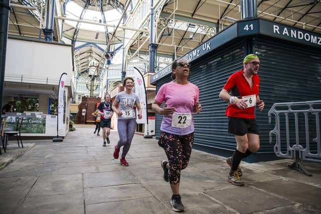 Halifax Urban Trail run through the town's iconic landmarks for Overgate Hospice. Calderdale Borough Market