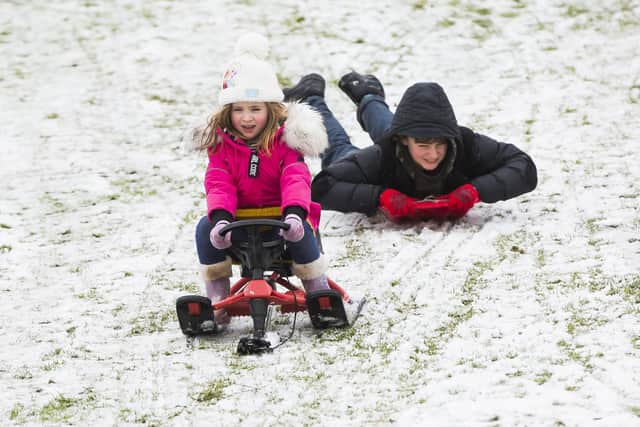 Sledging at Crow Wood Park, Sowerby Bridge. Tallulah Moyneux, five, and Rafferty Parkin, 11.