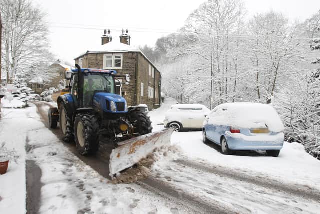 A snow plough and gritter in Mill Bank.