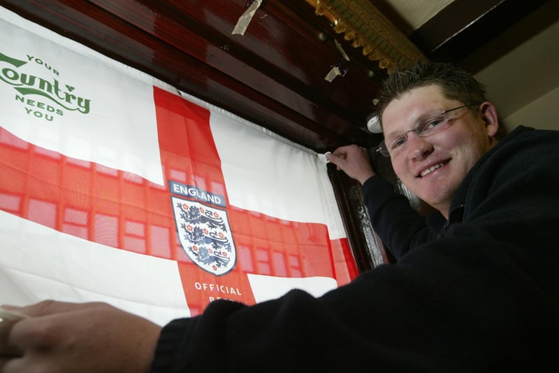 Landlord of the Westgate Pub Tim McKellar decks the pub out for the Euros in 2004.