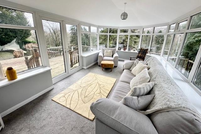 The south-facing garden room has an insulated roof, and air conditioning.