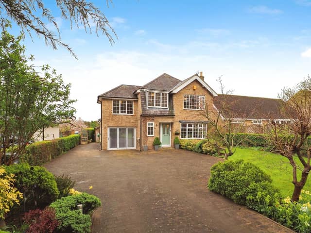 This four bedroom detached property in Brighouse is on the market for £525,000 with Yopa.