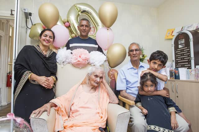 Pritam Kaur celebrates her 110th birthday at Woodfield Grange care home, Greetland. With, from the left, Amorpreet Kaur, Grandson Surinda Singh, son Darshan Singh, great-grandson Del-Jaan Singh, seven, and great-granddaughter Jesmine Kaur, four.