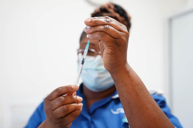 A nurse prepares a dose of a coronavirus vaccine. (Photo by Jacob King - WPA Pool / Getty Images)