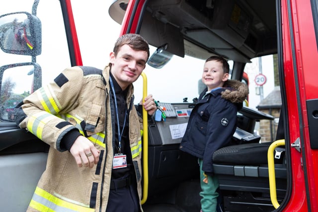 Firefighter Joseph Papworth with Louie Smith Barker at the Fire Fighters Charity fundraiser at Mytholmroyd Fire Station
