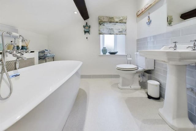 One of two house bathrooms with free-standing bath tubs.