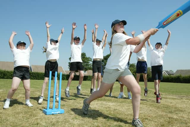 Cross Lane School, Elland achieved a favourable offsted report in 2006, with good improvement noted in sports. Pictured is Charlie Cole, 11, knocking one out of the park.