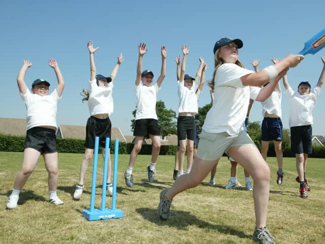 Cross Lane School, Elland achieved a favourable offsted report in 2006, with good improvement noted in sports. Pictured is Charlie Cole, 11, knocking one out of the park.