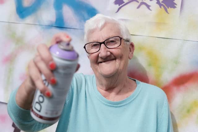 Resident Margaret Gimson tried out graffiti art