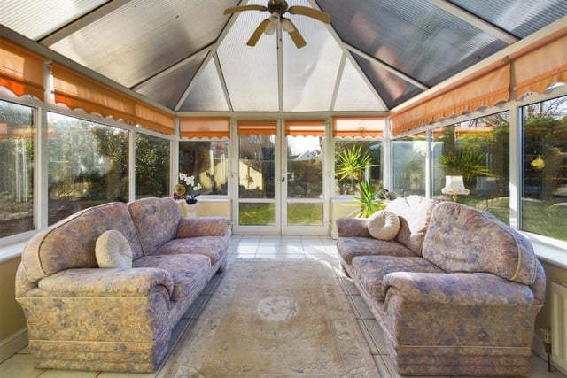 The garden room or conservatory gives versatile space with double doors out to the garden.