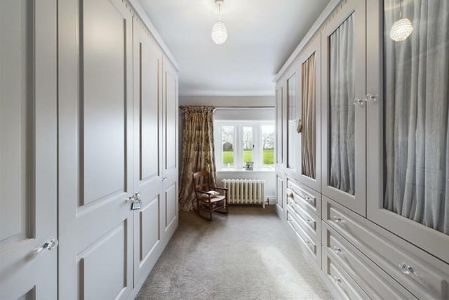 A bedroom used currently as a fitted out dressing room.