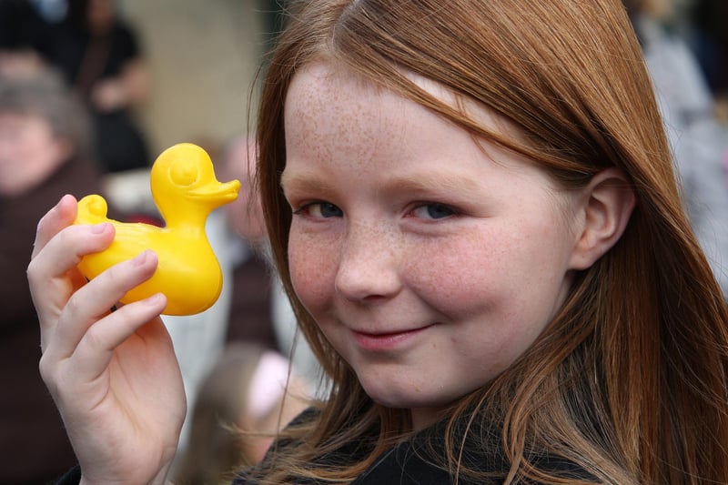 Hebden Bridge Duck Race. Ten-year-old Bronegh Sheridan picks her duck in 2009.