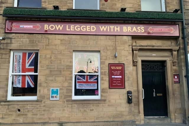 Bow Legged With Brass in Halifax town centre