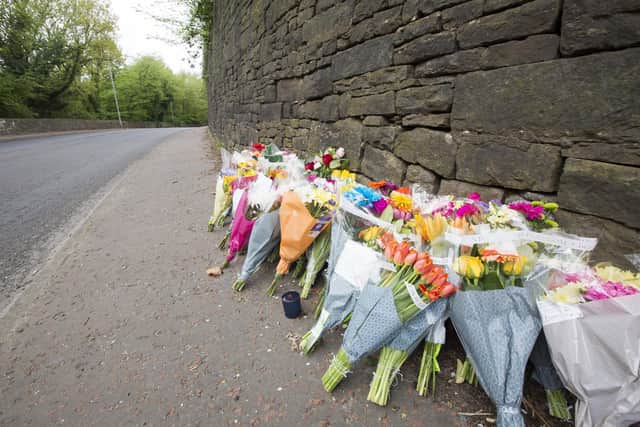Flowers at of fatal crash scene on Burnley Road