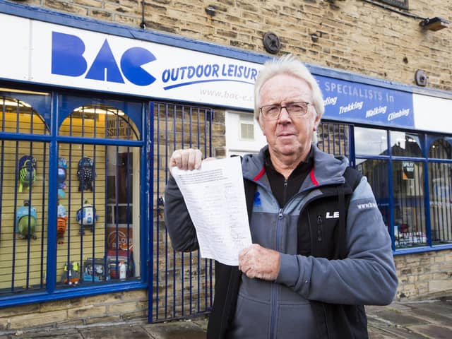 David Jackson at BAC Outdoor Leisure, Elland, with one of the petitions calling for Coronation Street car park to be kept