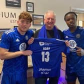 Jack Senior, Stephen Brown and Milli Alli with the shirt Noah wore to Wembley in 2016