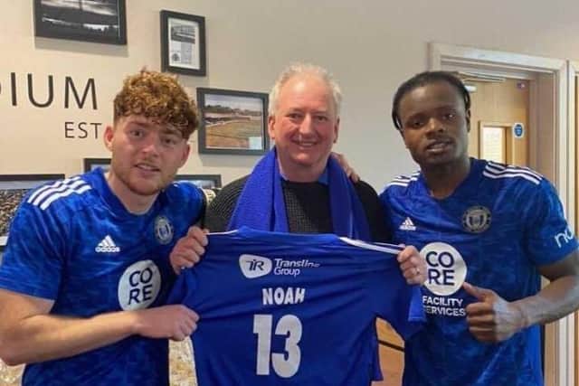 Jack Senior, Stephen Brown and Milli Alli with the shirt Noah wore to Wembley in 2016