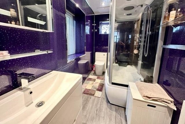 A luxurious bathroom includes a jacuzzi bath with aromatherapy spa.