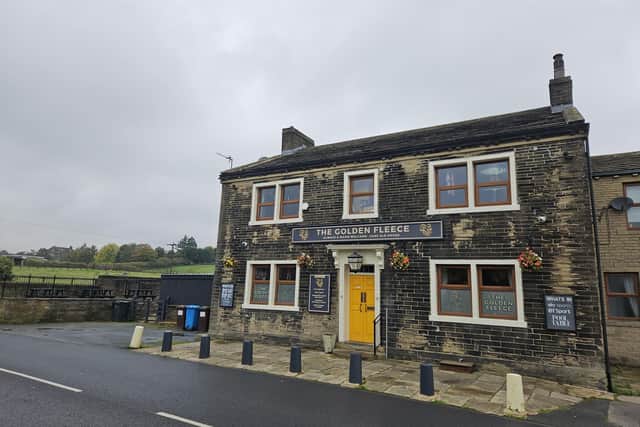 The new homes are planned for a strip of grazing land next to The Golden Fleece pub in Bradshaw (Credit: Callum Cuddeford)