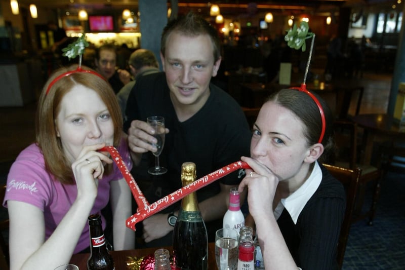 Getting into the New Year spirit at the Barracuda from the left are, Gail Wilkinson, Johnny Corbett and Jemma Flowitt.