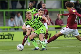 NAILSWORTH, ENGLAND - AUGUST 31:Jack Evans of Forest Green Rovers plays the ball under pressure during the Papa John's Trophy match between Forest Green Rovers and Northampton Town at The New Lawn on August 31, 2021 in Nailsworth, England. (Photo by Pete Norton/Getty Images)