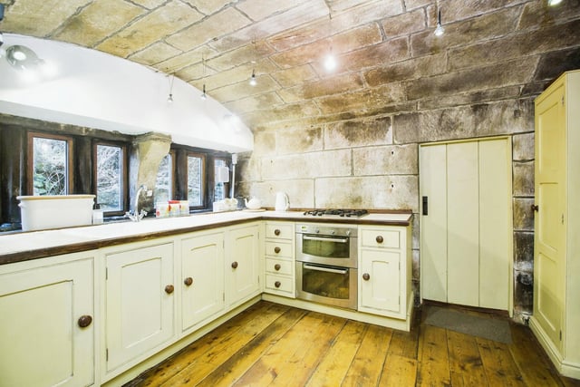 A vaulted stone ceiling features in the kitchen, with its locally made Drew Forsyth fitted units.