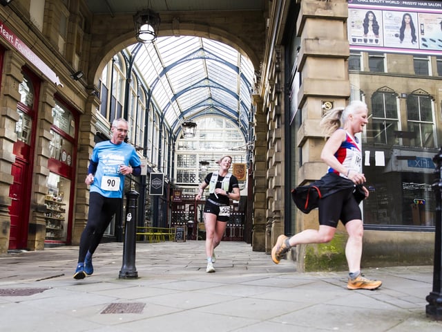 Halifax Urban Trail run through the town's iconic landmarks for Overgate Hospice. Calderdale Borough Market
