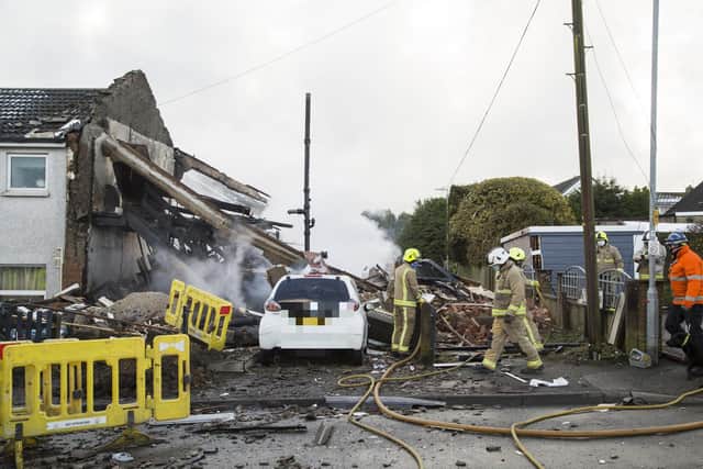 Firefighters attend the scene of an explosion at the house on Green Lane, Illingworth.