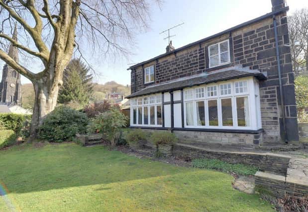 The attractive property has a prominent position in a leafy Todmorden lane.