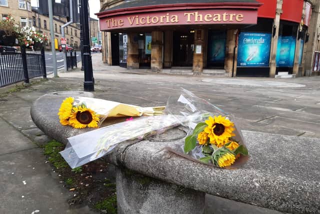 Flowers left by the Victoria Theatre in Halifax in tribute to the man who died