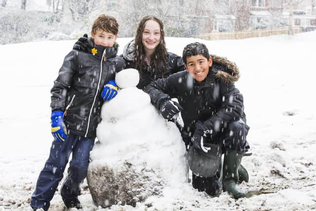 Fun in the snow at Crow Wood Park, Sowerby Bridge. From the left, Finn McKeown, nine, Mia McKeown, 14, and Ahmed Al-Kos, 10. 