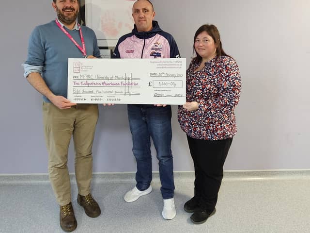 Ben and Gaynor present their cheque