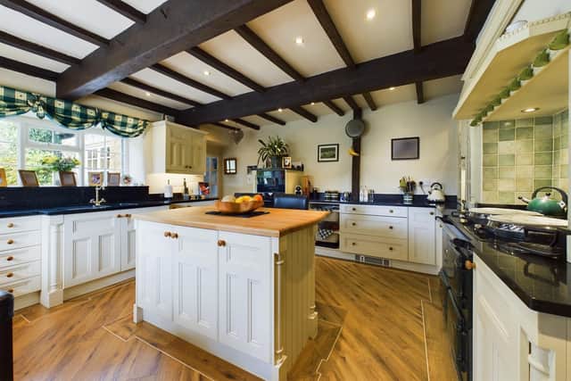Located in Luddenden Village, the stone-built Stoney Springs House is set within 0.8 acres of tiered, landscaped gardens, and boasts a detached cottage and adjoining barn