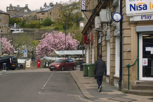Crown Street with the market in the background. The Nisa Local store on Crown Street was featured in the hit  BBC TV drama Happy Valley filmed in Hebden Bridge and other areas of Calderdale.