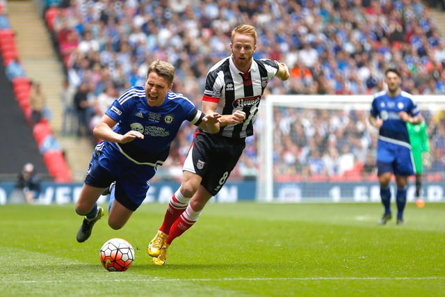 LONDON, ENGLAND - MAY 22: Nicky Wroe of FC Halifax Town is fouled by Craig Disley of Grimsby Town during the FA Trophy Final match between Grimsby Town FC v FC Halifax Town at Wembley Stadium on May 22, 2016 in London, England.  (Photo by Joel Ford/Getty Images)